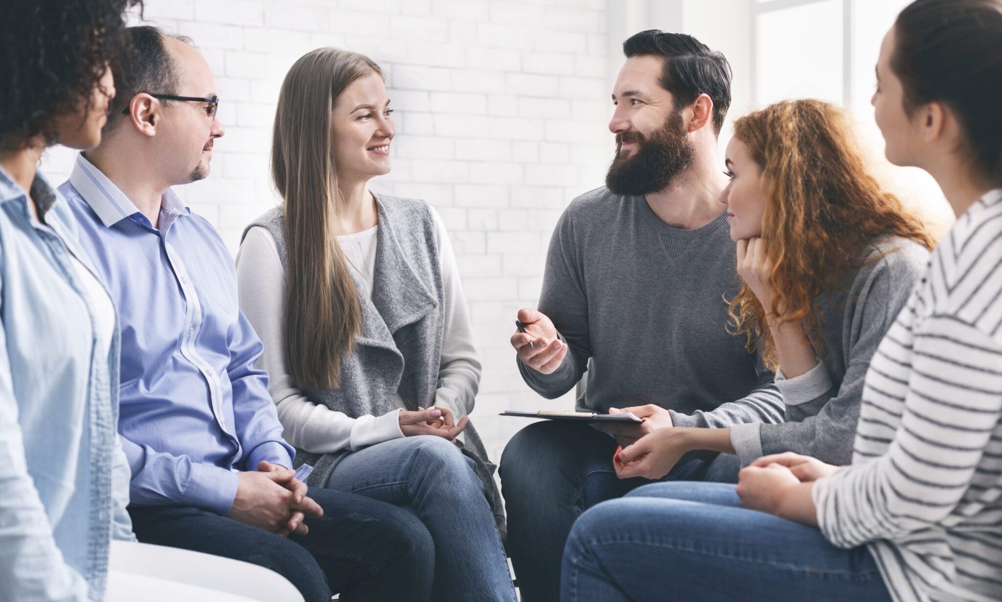 Therapist talking with patients during support group session